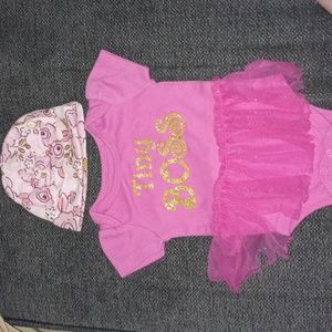 Tiny boss baby hat and onesie outfit with tutu.